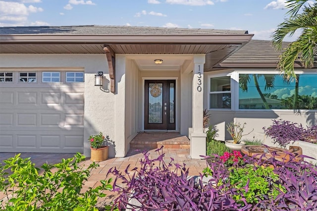 doorway to property featuring a garage