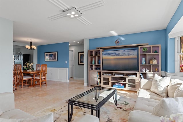 living room featuring a notable chandelier