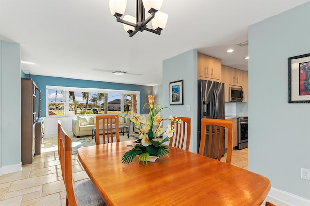 dining room with a notable chandelier