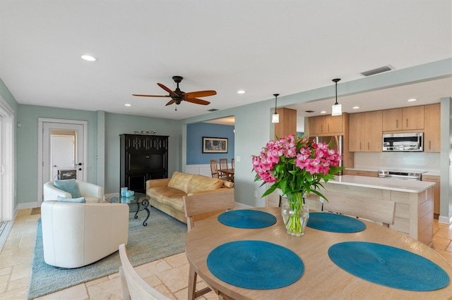 dining room featuring ceiling fan