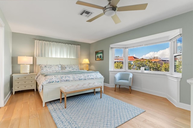 bedroom with ceiling fan and light hardwood / wood-style flooring