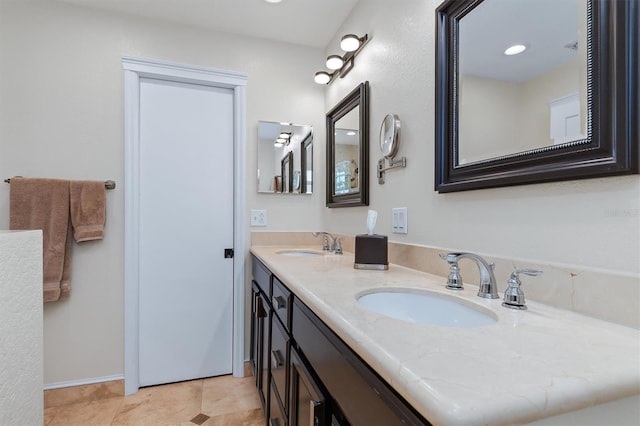 bathroom featuring tile patterned flooring and vanity