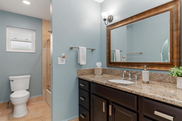 full bathroom featuring shower / bath combination with glass door, vanity, and toilet