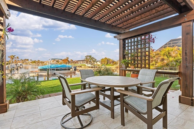 view of patio / terrace featuring a boat dock, a water view, and a pergola