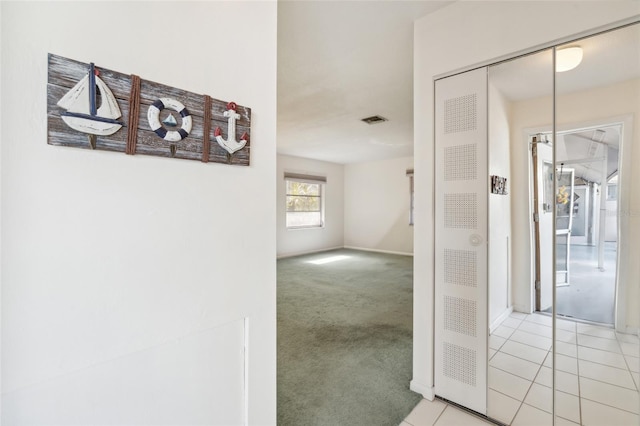 hallway with light carpet