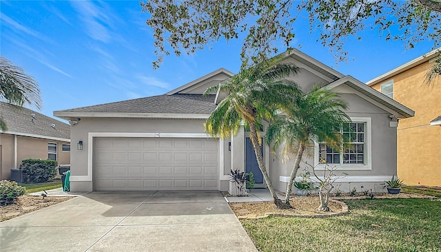 view of front of home featuring stucco siding, driveway, a shingled roof, and a garage