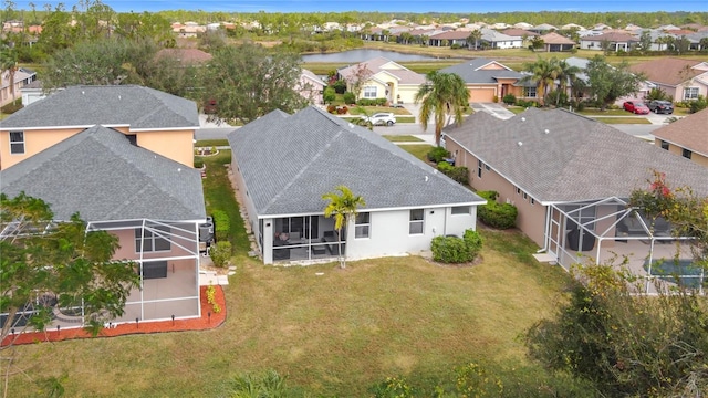 aerial view featuring a residential view and a water view