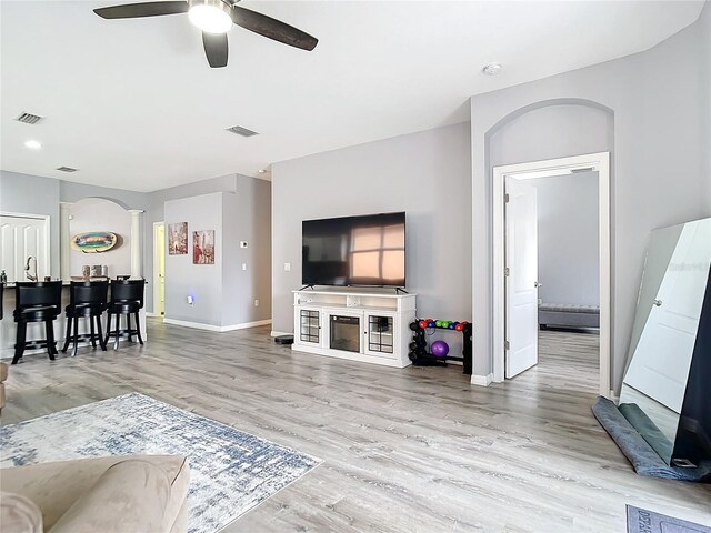 1796 Scarlett Ave, North Port, FL 34289 - living room with wood finished floors, a ceiling fan, visible vents, and baseboards
