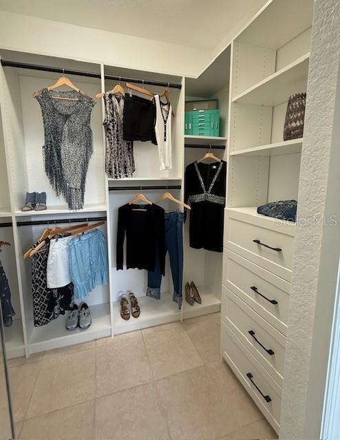 1796 Scarlett Ave, North Port, FL 34289 - walk in closet featuring light tile patterned floors