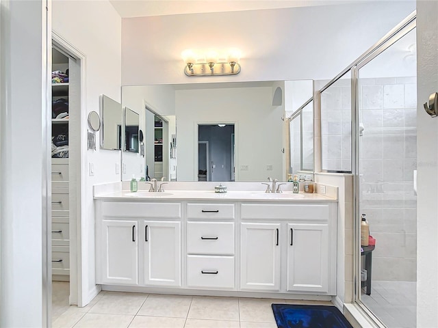 1796 Scarlett Ave, North Port, FL 34289 - full bathroom with tile patterned flooring, a stall shower, double vanity, and a sink