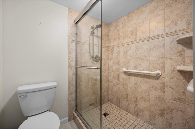 bathroom featuring toilet and walk in shower