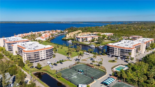 birds eye view of property with a water view