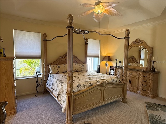 bedroom featuring ceiling fan, light carpet, and ornamental molding