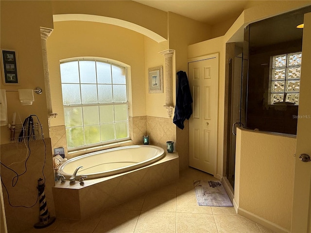 bathroom with tile patterned flooring and plus walk in shower