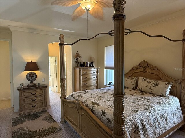 bedroom featuring carpet flooring, ceiling fan, and ornamental molding