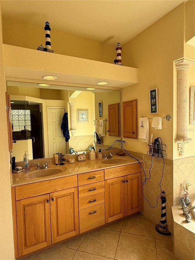 bathroom with tile patterned flooring and vanity