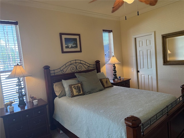 bedroom with multiple windows, ceiling fan, and crown molding