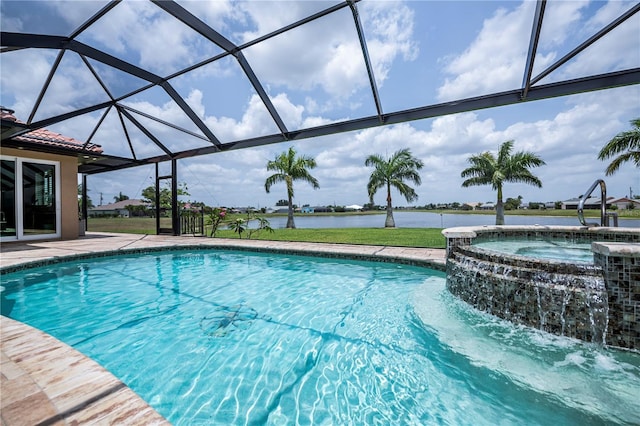 view of swimming pool featuring an in ground hot tub, a patio, a water view, and glass enclosure