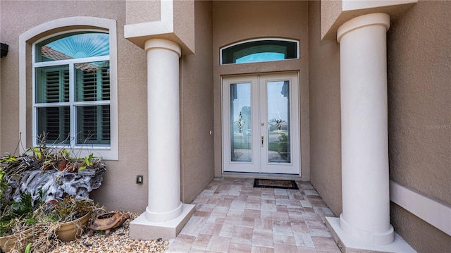 entrance to property featuring french doors