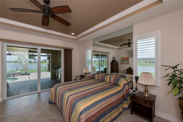 bedroom with a raised ceiling, ceiling fan, access to exterior, ornamental molding, and light tile patterned floors