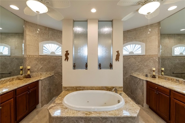 bathroom with vanity, tile walls, and a healthy amount of sunlight