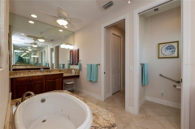 bathroom with a bathing tub, vanity, and ceiling fan