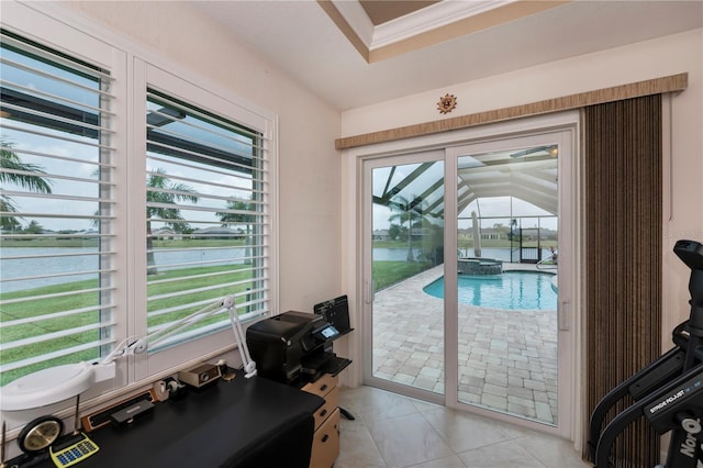 entryway with a water view and light tile patterned floors