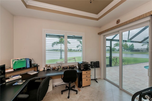 office area featuring a raised ceiling, light tile patterned floors, crown molding, and a water view