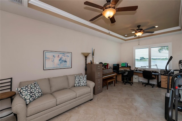 home office featuring a tray ceiling, ceiling fan, and crown molding