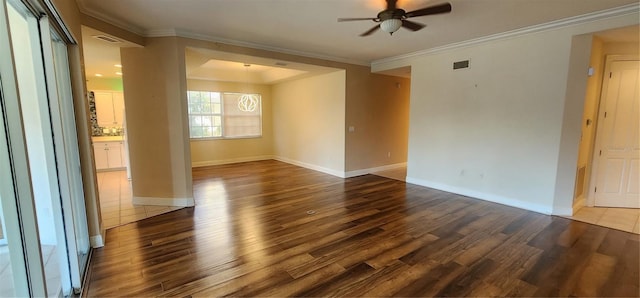 spare room featuring hardwood / wood-style flooring, ceiling fan, and ornamental molding