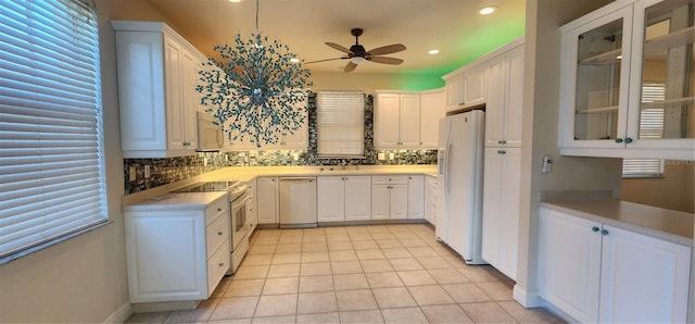 kitchen with ceiling fan, white appliances, white cabinetry, and light tile patterned floors