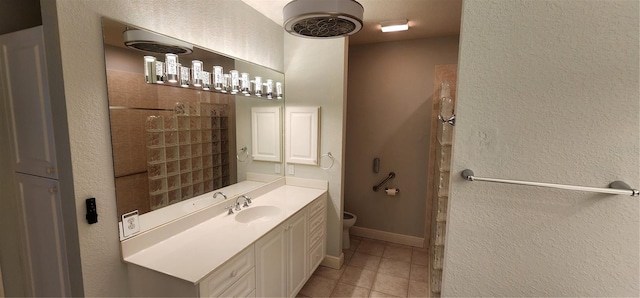 bathroom featuring walk in shower, tile patterned flooring, vanity, and toilet