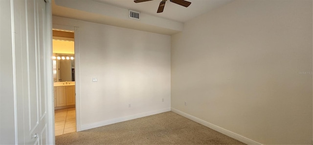 carpeted empty room with ceiling fan