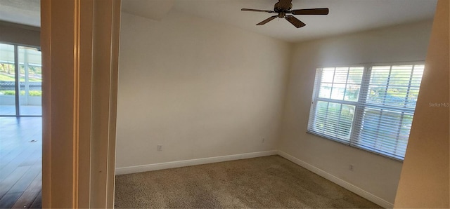 empty room featuring carpet flooring and ceiling fan