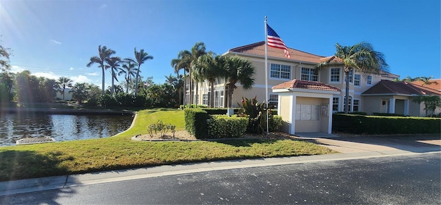 view of front of property with a water view