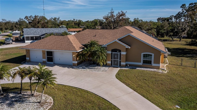 ranch-style house with a garage and a front yard