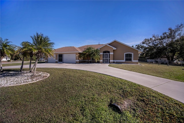 ranch-style house with a garage and a front yard