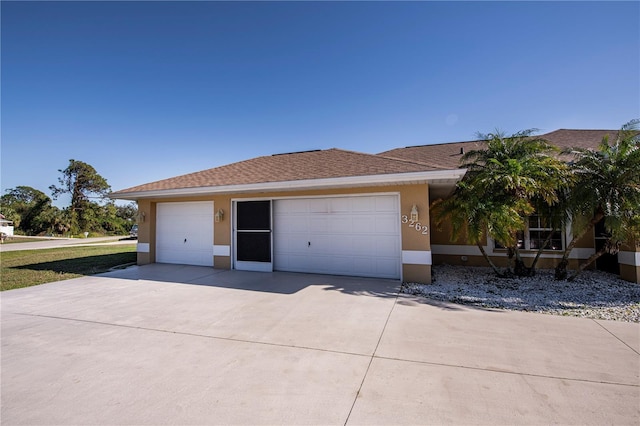 ranch-style home with a garage