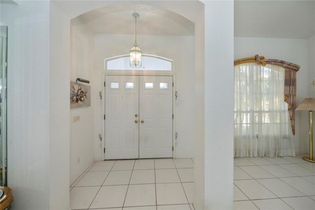 tiled foyer entrance featuring a healthy amount of sunlight