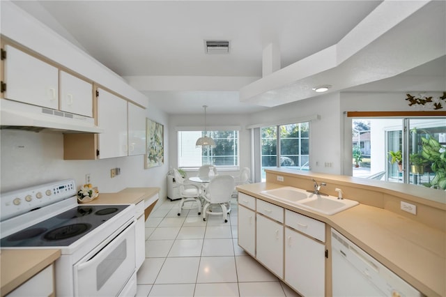 kitchen with white cabinets, white appliances, decorative light fixtures, and sink