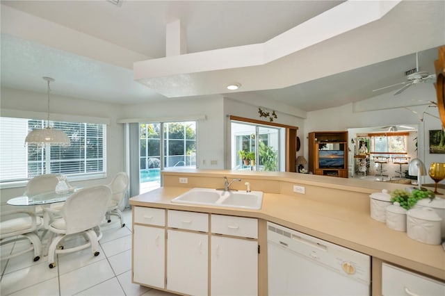 kitchen with white dishwasher, sink, hanging light fixtures, ceiling fan, and white cabinetry