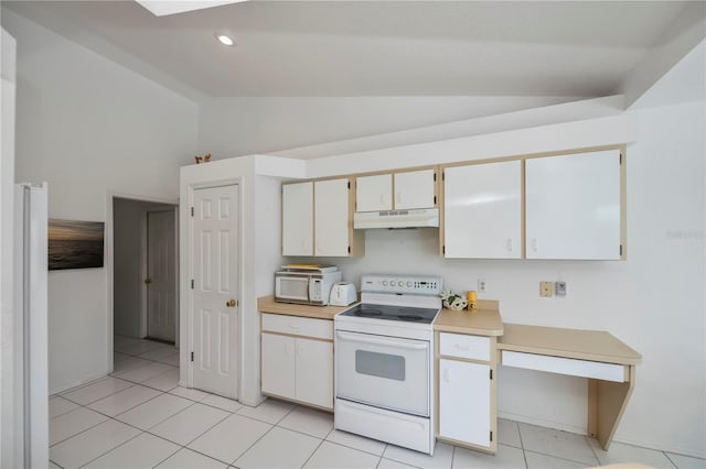 kitchen featuring light tile patterned floors, white appliances, and vaulted ceiling