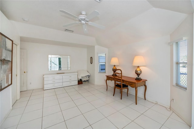 tiled office space with a wealth of natural light, vaulted ceiling, and ceiling fan