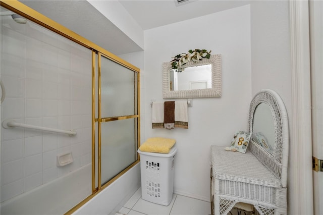 bathroom featuring combined bath / shower with glass door and tile patterned floors