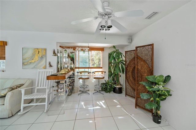 tiled dining room featuring ceiling fan