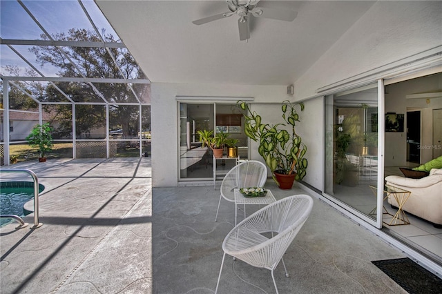 view of patio / terrace with ceiling fan and a lanai