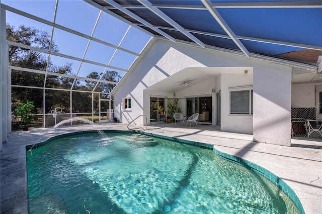 view of pool with a patio area, ceiling fan, and a lanai