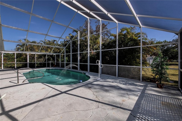 view of pool with a patio and a lanai