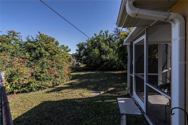 view of yard featuring a sunroom