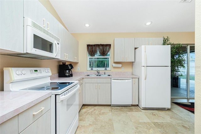 kitchen with sink and white appliances